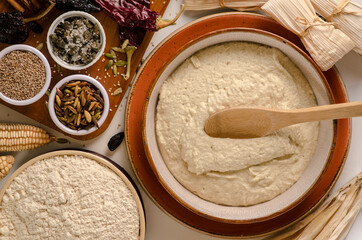 Dough for tamales and some ingredients.