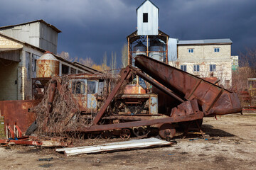 Devastation and decline in the agro-industrial sector. Cemetery of old rusty agricultural...