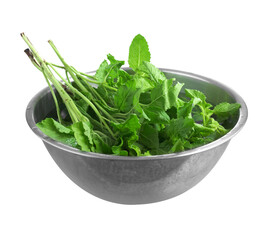 Thai basil in stainless bowl on white background