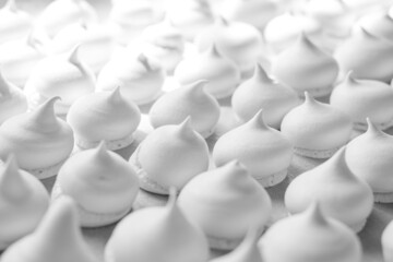 Obraz premium Homemade meringue cookies. White sweet meringue. Tray of meringues