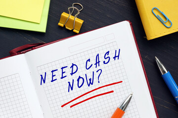 Business concept about NEED CASH NOW? with inscription on the sheet.