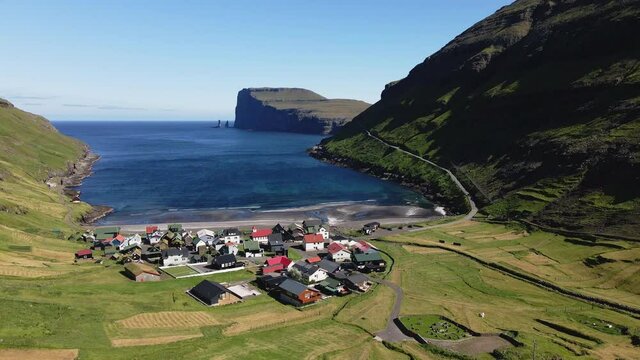 Aerial View of Village in Faroe Islands and Endless Sea Horizon