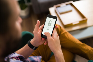 Man typing his username and password