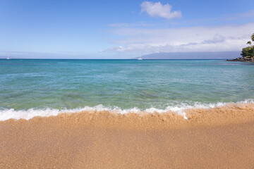 Wave on sand close up in tropical beach. Ocean water background 