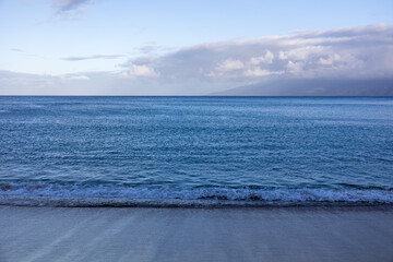 Colorful ocean beach sunrise with deep clouded sky. Beautiful cloud over the sea during sunrise. 