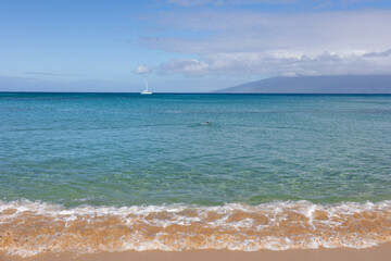 Fototapeta na wymiar Wave on sand close up in tropical beach. Ocean water background 