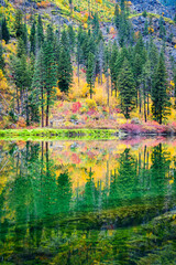 Fall colors reflect in the Wenatchee River in the Cascade Mountains as it passed through the Tumwater Canyon