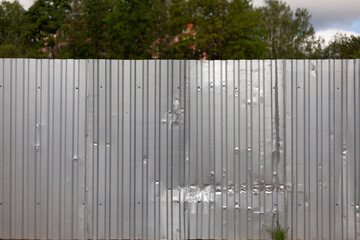 Fototapeta premium Fence made of steel. Simple fencing. It is protected by a metal fence. Crutty material.