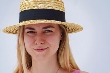 Beautiful blonde in a straw hat