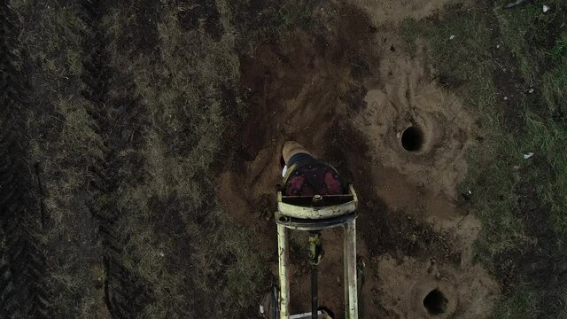 Top view of a huge drill making massive holes in the ground, construction
