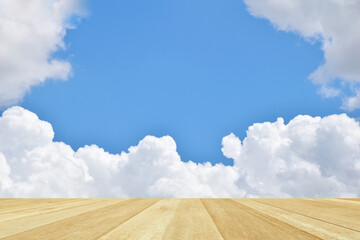 Fototapeta premium Empty top wooden table on blue sky with cloud for background