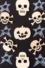halloween themed background with retro wooden shapes on black