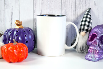 Halloween farmhouse theme coffee mug mockup with purple skull, prple orange and white pumpkin, and...