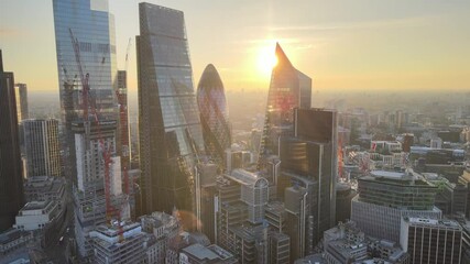 luxury skyscrapers in City financial and economy centre against sunrise sky. - Powered by Adobe