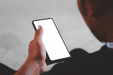 Man hand holding smartphone mock up blank screen for advertising text
