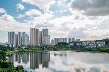 Fototapeta na wymiar View of modern buildings and Gwanggyo Lake Park in Suwon, Korea