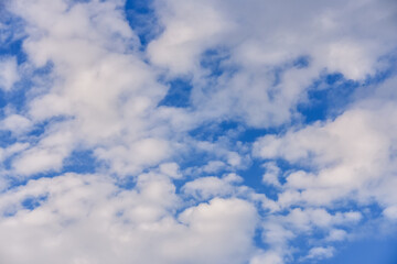 blue sky background with cumulus white clouds