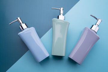 natural cosmetics bottle containers on color paper background, empty bottle ,natural beauty skincare product,  beauty product concept 
