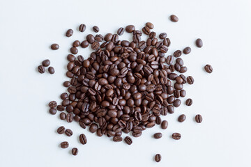 fresh roasted Yemeni mocha coffee beans on white paper
