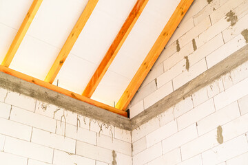 Wooden lathing of the roof of an unfinished house