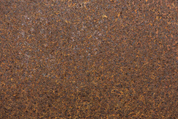 Texture of completely rusted metal plate, orange brown rust color. Old iron sheet covered with rust and corrosion. Rusty iron panel. Texture or background..