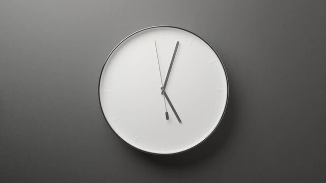 Clock Face on Dark Grey Office Wall in Timelapse