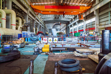 Fototapeta na wymiar Giant pipes, tubes and equipment inside modern industrial power plant