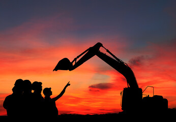 Silhouette engineer standing orders for construction crews and Excavator and machinery in an outdoor mine work on high ground heavy industry and safety concept - obrazy, fototapety, plakaty