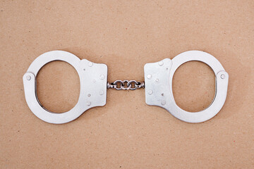 Top view of gray metal handcuffs