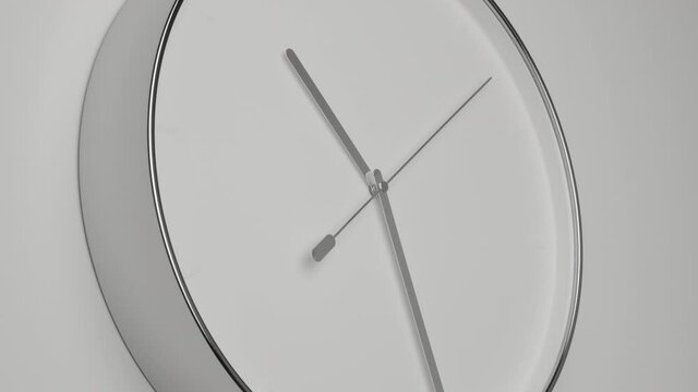 Clock Face on White Office Wall in Timelapse