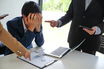 Angry boss  Bullying with an out of control boss shouting to a stressed employee. Anger issues and...