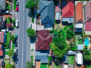 Fototapeta na wymiar Panoramic Aerial Drone view of Suburban Sydney housing, roof tops, the streets and the parks NSW Australia
