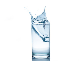 splashing water in a glass with ice isolated white background