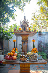 A brown shrine of the household god in house area.Thai architecture, Thai culture.
R