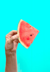 Watermelon slice fruit in hand