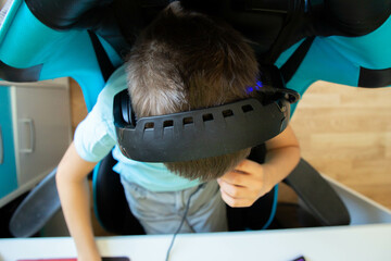 a boy plays in computer game