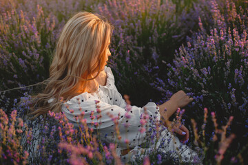 Woman in a white dress in a lavender field
