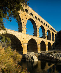 Fototapeta premium Image of famous landmark Roman Bridge Pont du Gard in southern France..