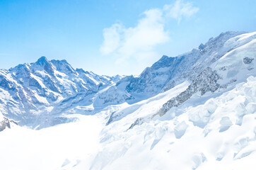 Alps Eiger and Jungfrau dramatic snowy mountain peaks panorama Switzerland.