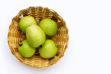 Fresh guava in bamboo basket on white background.