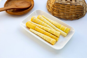 Bamboo shoots in white plate on white background.