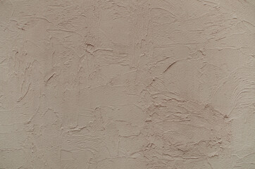 Brown plaster texture wall background. Closeup of plaster painted wall texture.