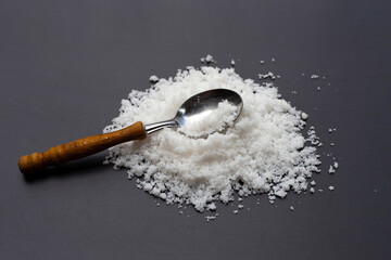 White salt on dark background.