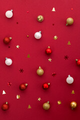christmas balls and decorations on burgundy background pattern