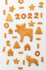 gingerbread cookies new year with animals and numbers 2022 on a white background