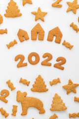Fototapeta na wymiar gingerbread cookies new year with animals and numbers 2022 on a white background