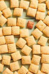 Corn pillows on color wooden background. Concept of uniqueness