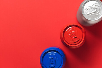 Cans of soda on color background