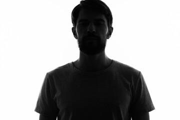 silhouette of a man gestures with his hands black and white photo