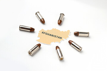 Afghanistan map logo icon with real gun bullet ammo around country on white background in concept of middle east war and conflict